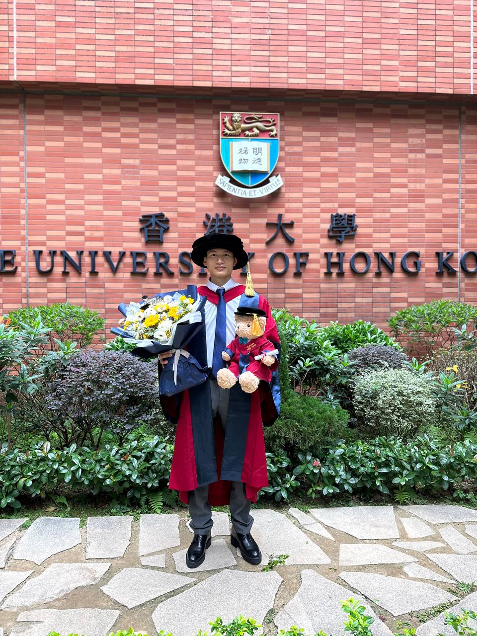 Dr. Antonio Xing in graduation gown at The University of Hong Kong